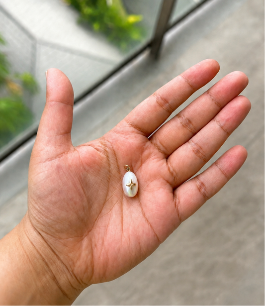 Pearl Power teardrop pearl pendant with handmade metal detail